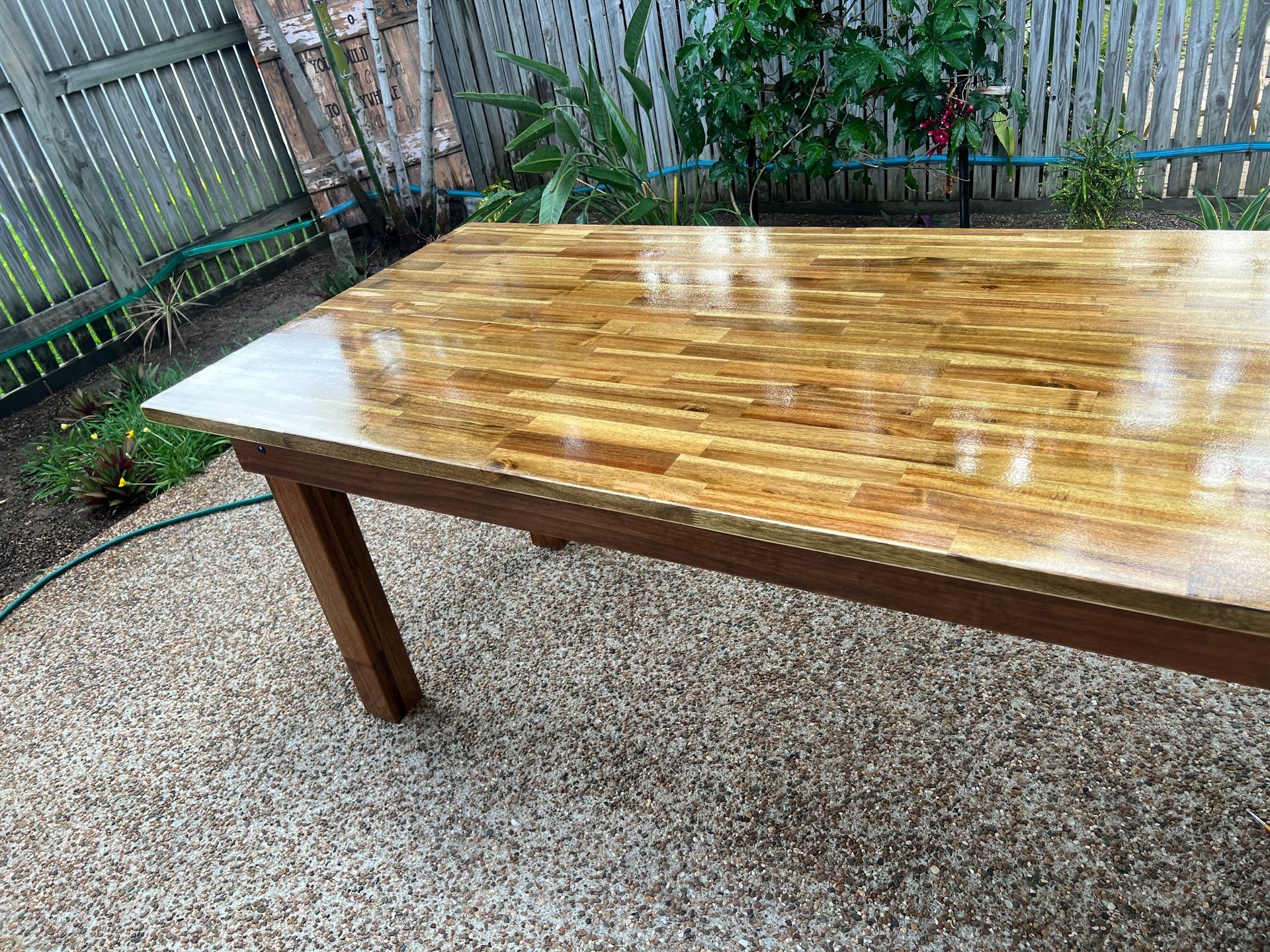 Custom wooden table with smooth finish and natural wood grain. Handcrafted wooden dining table showcasing fine craftsmanship and sturdy design. Epoxy resin