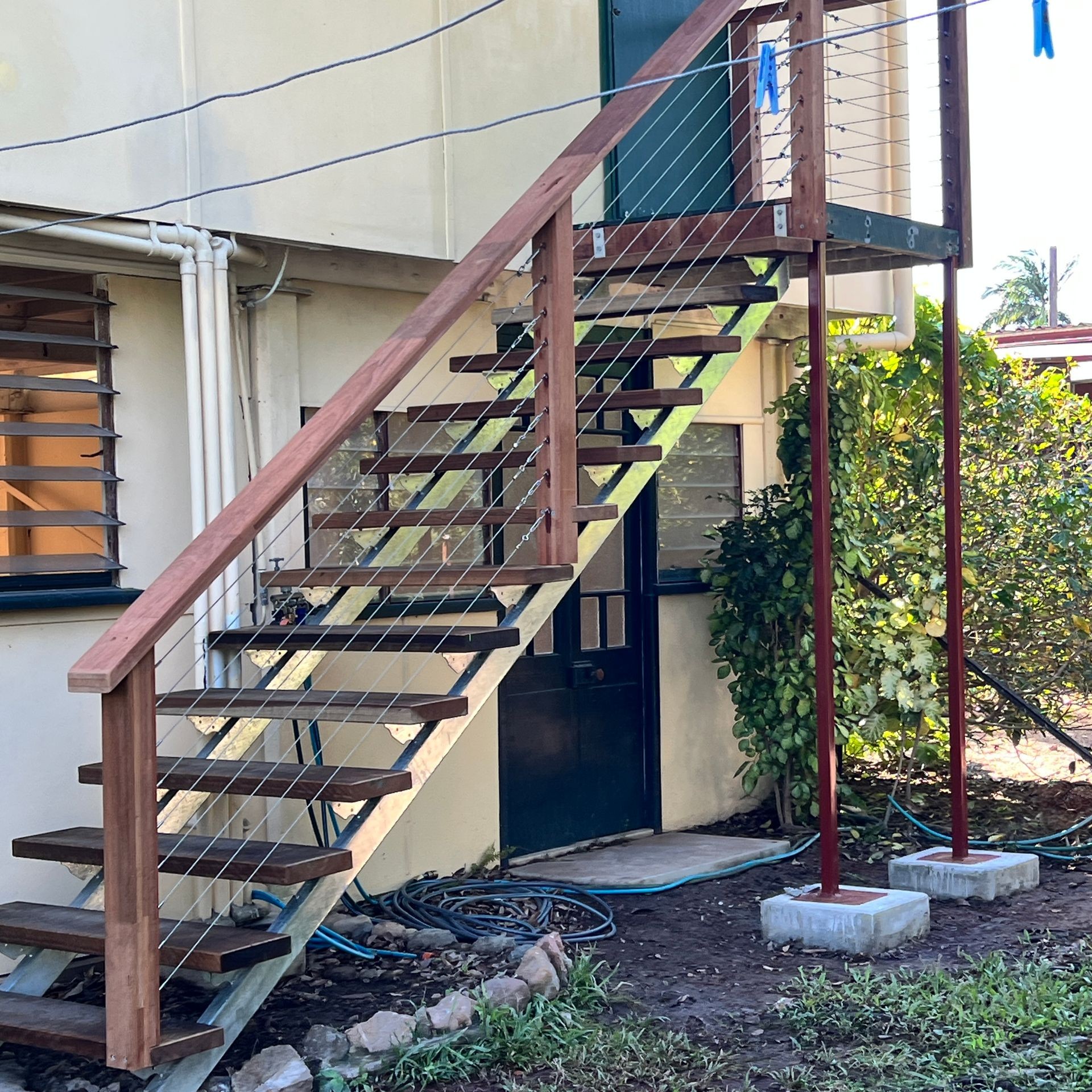 Custom-built wooden pergola providing shade and style in a backyard setting.” “Sturdy outdoor with detailed craftsmanship and natural finish